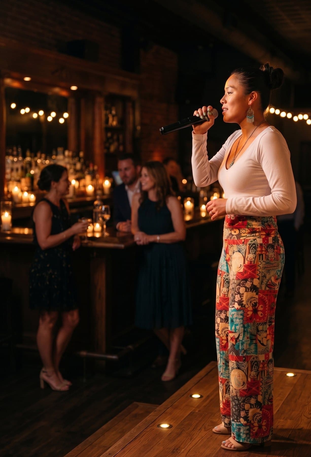 Ixchel Dion performing at an intimate candlelit venue