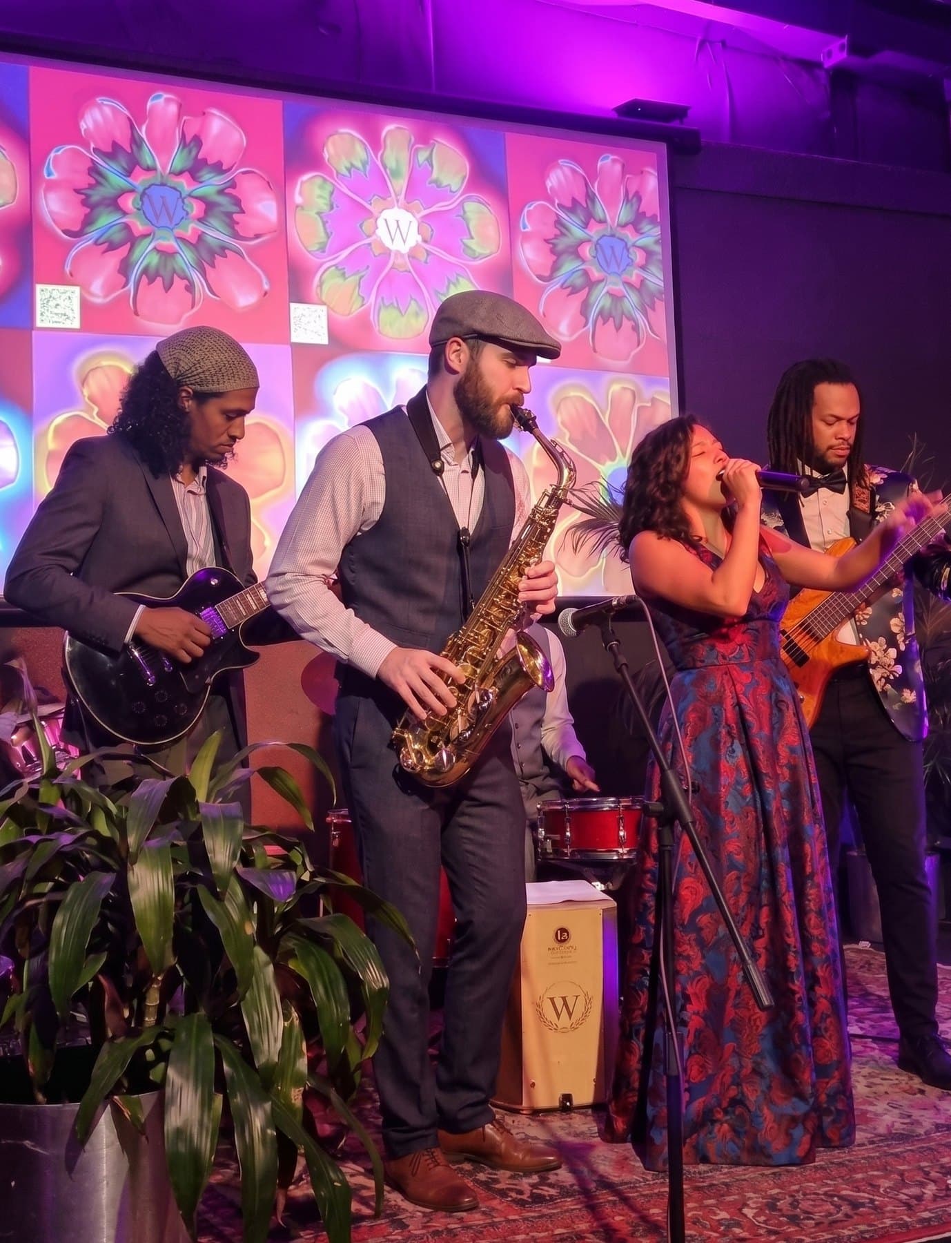 Ixchel Dion performing with her full band at a private celebration