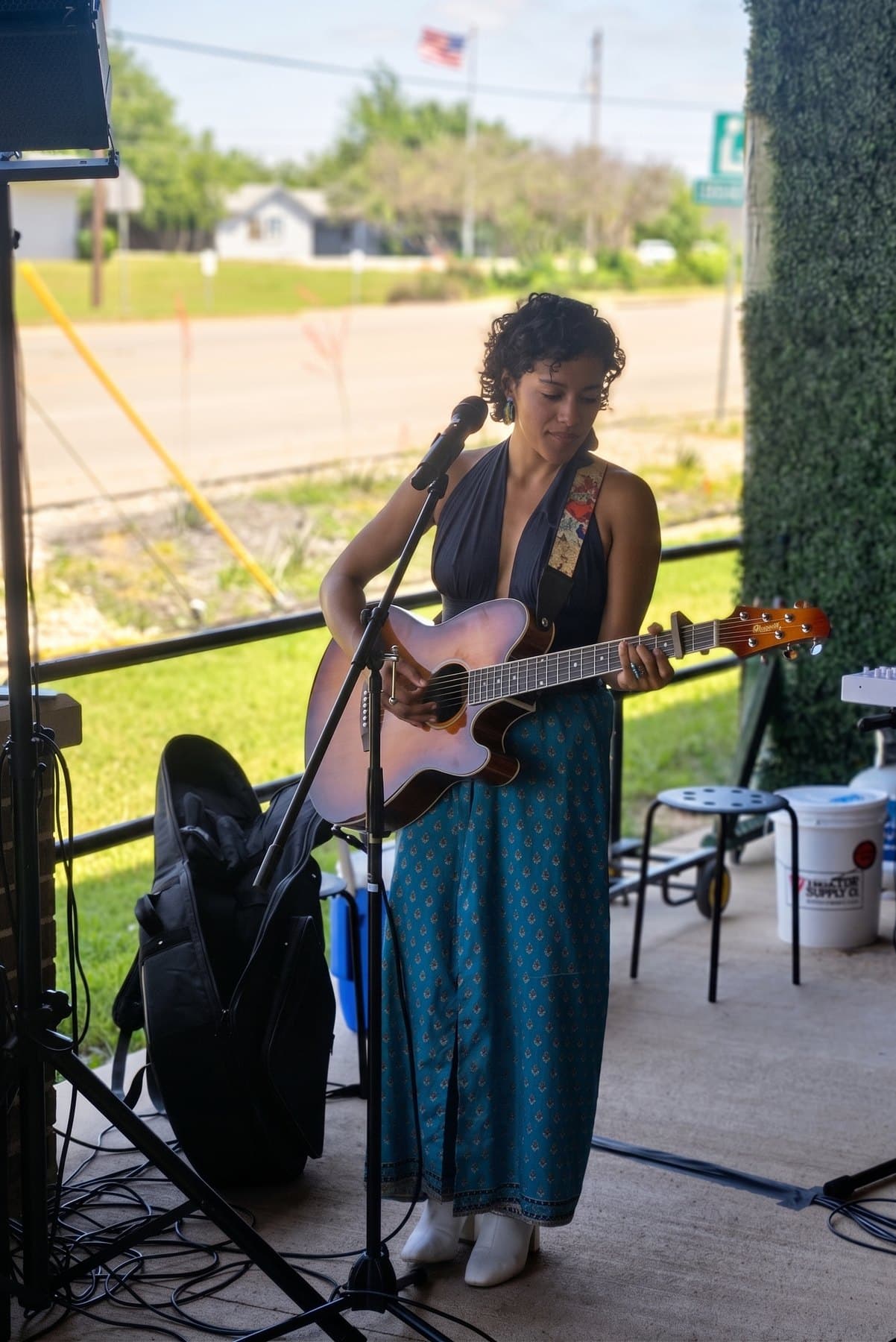Ixchel Dion performing live with acoustic guitar